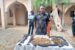 Ex-Army Lance Corporal Sa’idu Lawal with rifles, a cache of ammunition and magazines he was going to deliver in Gusau, Zamfara
