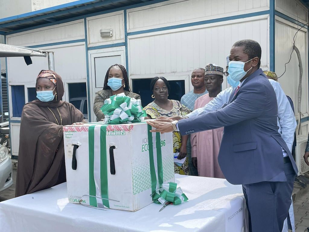 Amina Dambatta off MTN hands over the J &J COVID-19 vaccine to an official of National Primary Health Care Development Agency (NPHCDA)