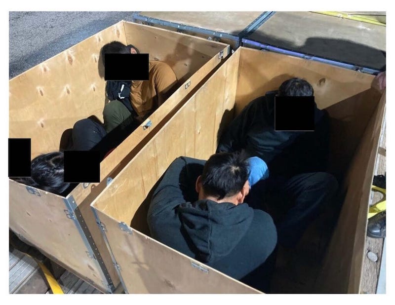 Migrants hidden in suit cases by people smugglers