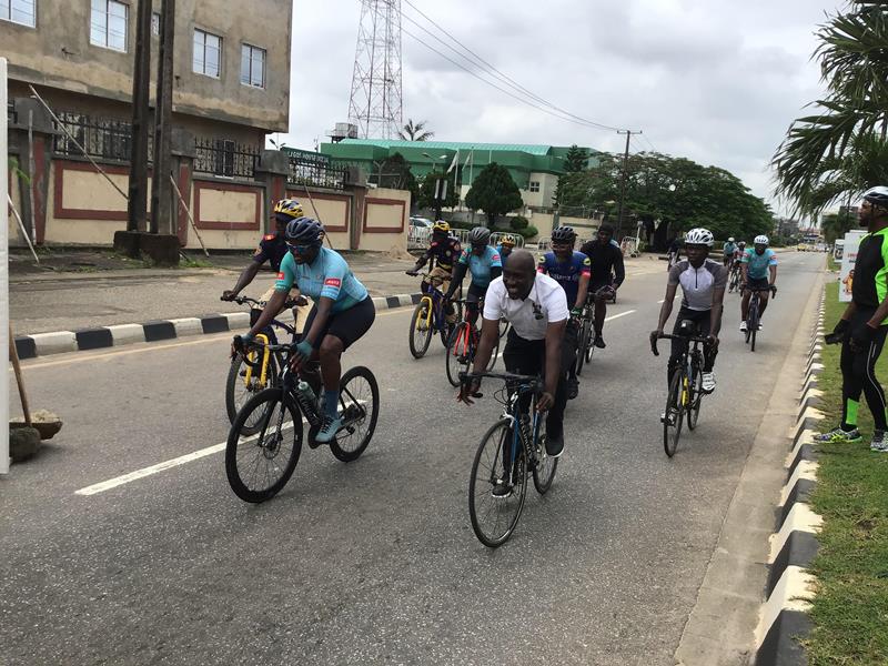 Permanent Secretary, Ministry of Transportation, Gbolahan Toriola (white) riding a bicycle with others