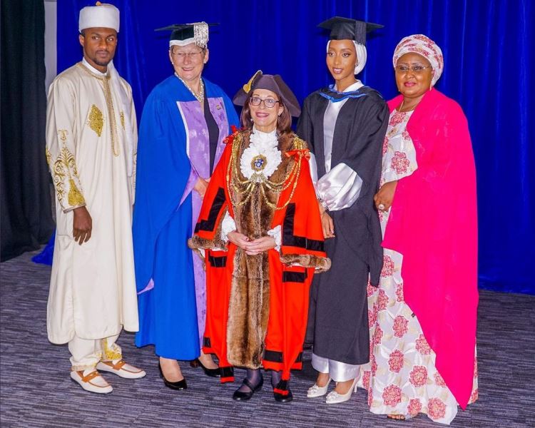 Aisha with her daughter and others at the event