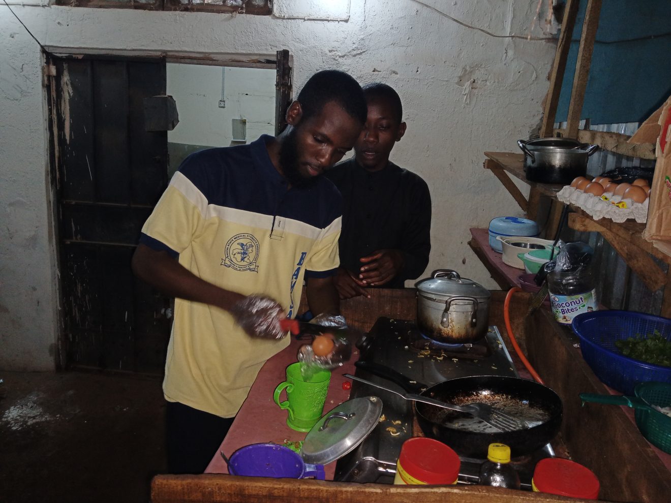 Usman Abubakar-Rimi, a final year medical student of UDUS, turns to street food vendor due prolonged strike by university lecturers (ASUU)
