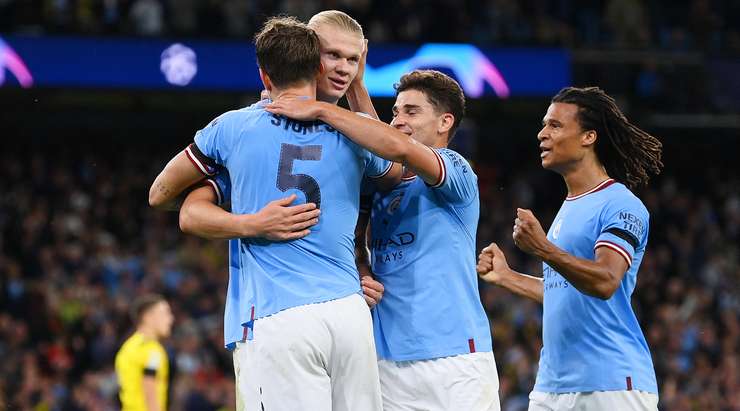 Man. City players celebrate their second goal with Haaland
