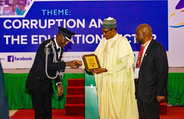Buhari presents award to SP Amah