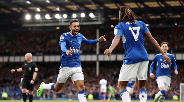 Iwobi celebrates with goal-scorer Dwight McNeil