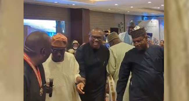 Obasanjo led Obi to his seat