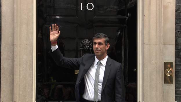 Sunak entering 10 Downing Street