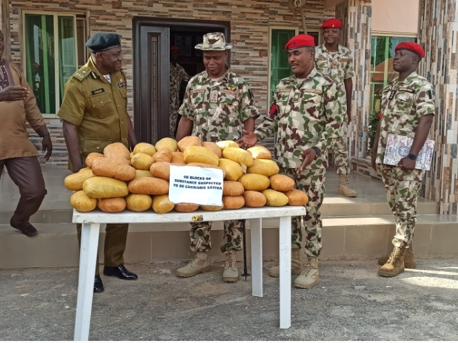Nigerian Army troops of Operation HADIN KAI (OPHK) hand 98 parcel of abandoned cannabis sativa worth N4.9 million to the NDLEA in Yobe