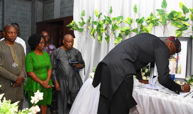Sanwo-Olu signing the condolence register