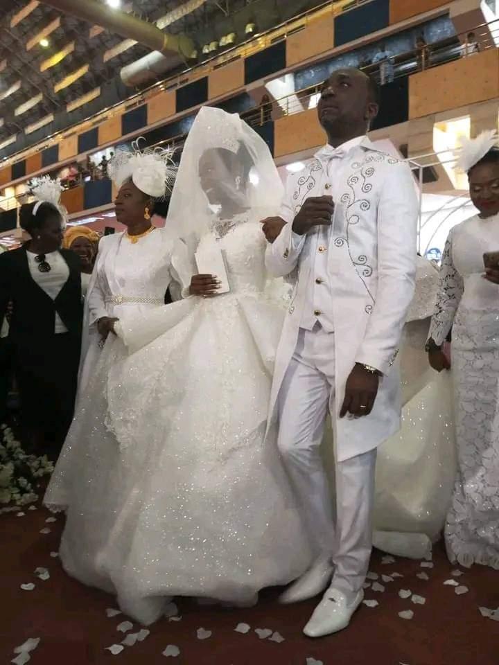 Pastor Enenche and his wife taking their daughter to the altar 