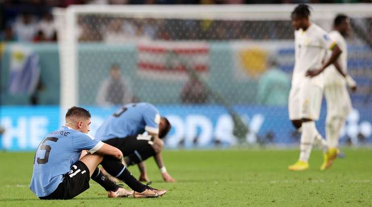 Ghana and Uruguay players down and out