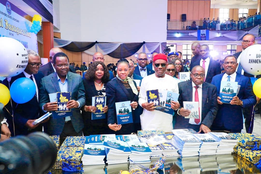 Governor of Rivers State, Nyesom Ezenwo Wike (3rd right), his wife, Hon. Justice Suzzette Eberechi Nyesom-Wike (middle); Rivers State Chief Judge, Hon Justice Simeon Amadi (2nd right); Rivers State Attorney General and Commissioner for Justice, Prof. Zaccheaus Adangor, SAN (1st right); Hon. Justice Ihemnacho W. Obuzor , President of the Rivers State Customary Court of Appeal (1st left); Speaker, Rivers State House of Assembly, Rt. Hon. Ikunyi-Owaji Ibani (2nd left) and former Chief Judge of Rivers State, Hon. Justice Adama Iyayi-Lamikanra (3rd left) at the unveiling of the "Family Court Rules, the Guide” and “The Child, Ethics and the Law: A Simplified Law Guide for Children and Young Persons,” after the inauguration of Rivers State Family Court in Port Harcourt on Monday