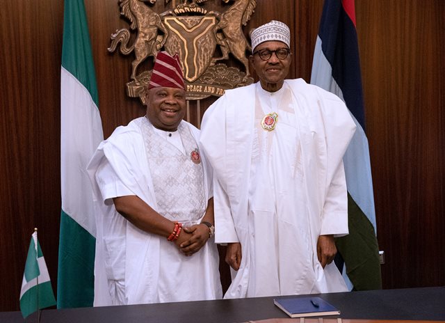 Adeleke shaking hand with the president at the State House, Abuja
