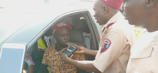 FRSC official conducting alcohol test on a commercial driver in Bauchi