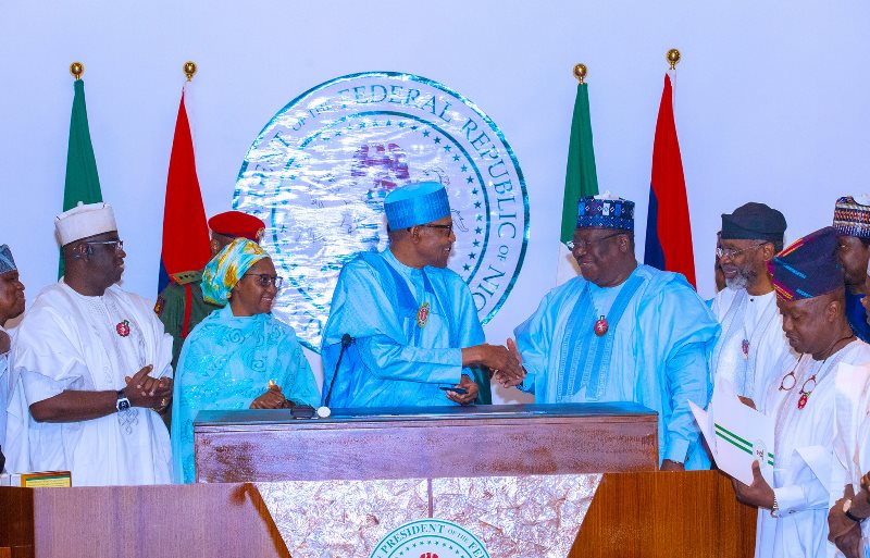 Buhari with Lawan and others at the signing of the budget on Tuesday.