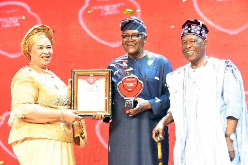L--R, Chairman of Occasions, Mrs. Ajoritsedere Awosika, President/CE, Dangote Industries limited, Aliko Dangote, with the Vanguard 2022 Personality of the year Award, Publisher of Vanguard Newspapers, Sam Amuka, at the Vanguard Newspapers 2022 Awards in Lagos on Friday 27th January 2023