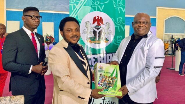 General-Overseer-of-Omega-Power-Ministries-receiving-the-Nigeria-Books-of-Records-after-his-induction-into-the-book-in-Port-Harcourt-on-Sunday