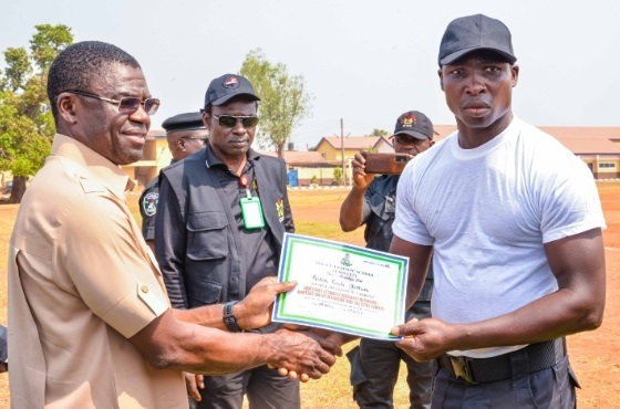 Edo Deputy Governor, Philip Shaibu presenting certificate to one of the graduands