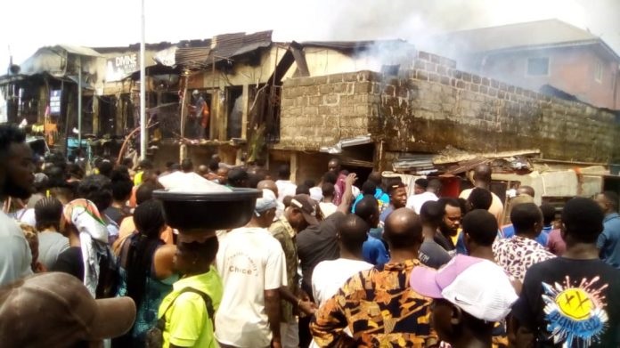 Traders in tears as fire razes building housing many stores inside Lagos Market, Oba Market, Ring Road, Edo State