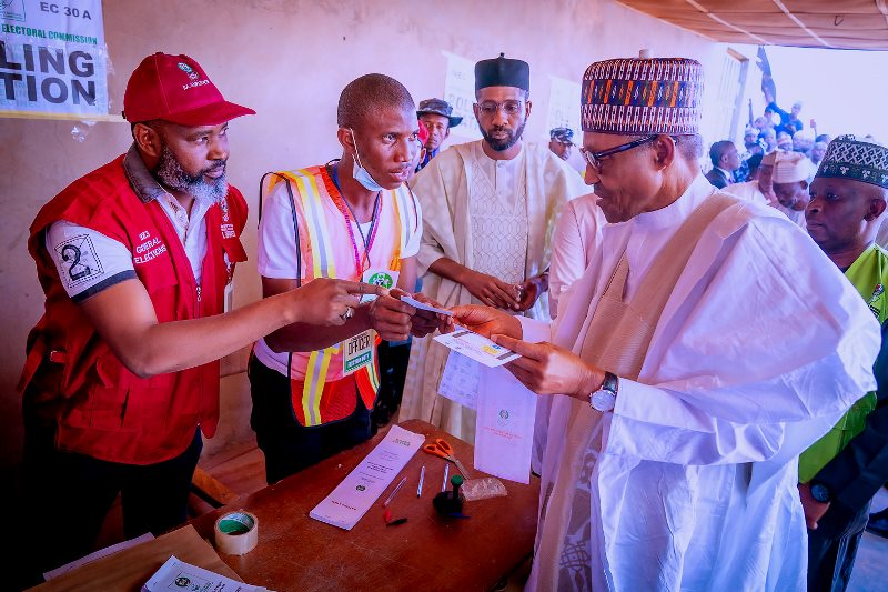 The president with INEC officials in Daura