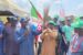 Ekiti local government area of Kwara APC Chairman, Hon. Wale Awelewa presenting the party’s flag to some of the defectors in Epe-Opin