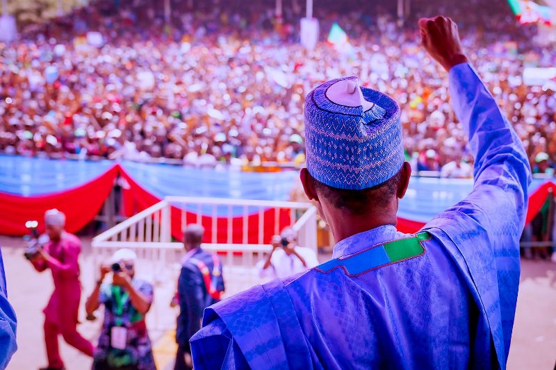 Buhari waving to the large crowd