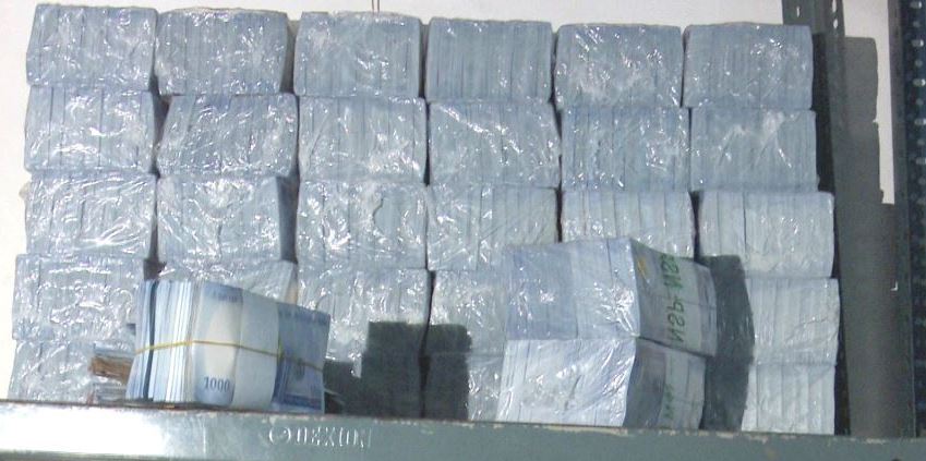 Packs of new naira notes hoarded by a commercial bank in Abuja