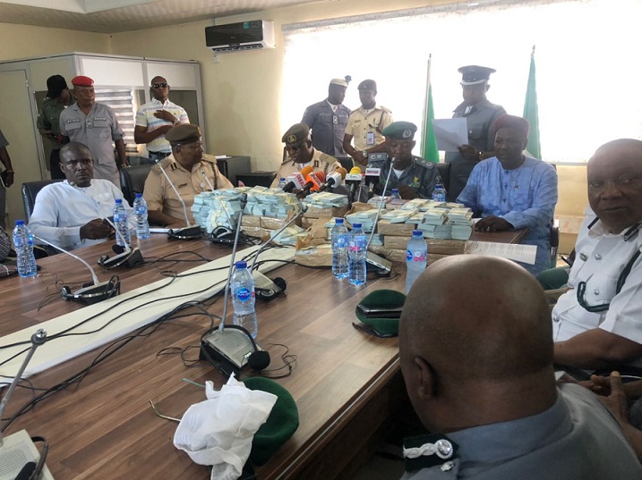 Comptroller Dera Nnadi of NCS in the middle, by his right Comptroller of Immgration Dr MC Dike and others during the briefing at SEME