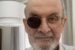 Six months after he was attacked in New York, Salman Rushdie shares photo showing scars to his face and a darkened lens in his glasses