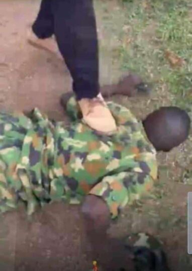 The soldier being maltreated by students of UNIBEN