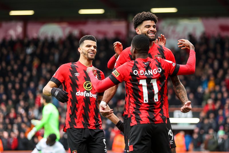 Bournemouth players celebrate victory over Liverpool.