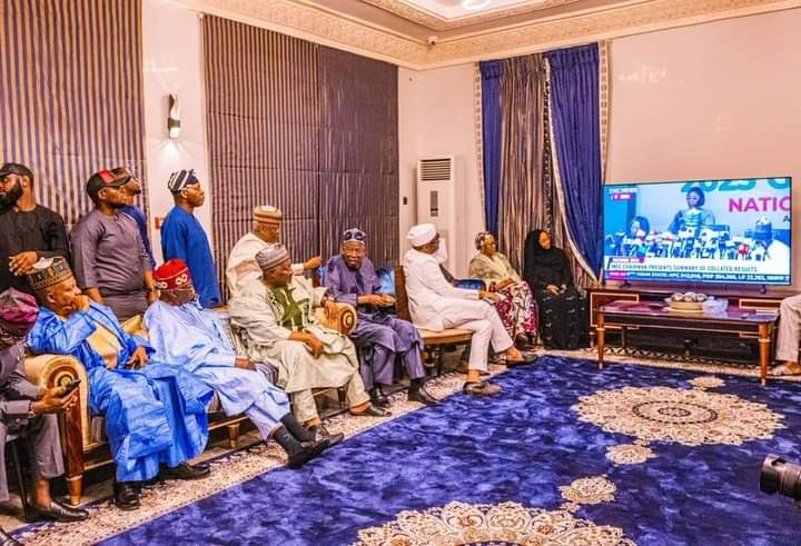Tinubu and other APC Chieftains watching the declaration by INEC Chairman on television at his home  