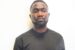 EFCC operatives arrest 32-year-old Enock Ogungbamigbe for serially duping Nigerians with fake Canada visa and job offers in Abuja.