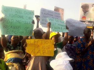 PDP members protest in Lagos; accuse traditional ruler of cursing APC opponents