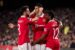 Marcus Rashford is congratulated by his Manchester United team-mates