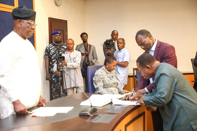 Rivers State governor, Nyesom Ezenwo Wike (left) observing the members of the Rivers State Civil Service Commission taking oath of office at the Government House, Port Harcourt on Monday