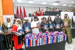 Gov. Nyesom Wike launching the books on  Justice Adolphus Enebeli, who retires from Rivers judiciary on Friday after 31 years of service to Rivers