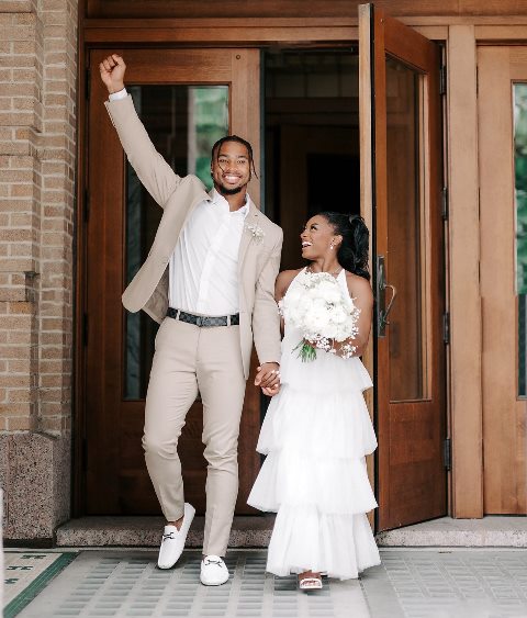 Biles and Owen during their wedding
