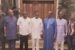 Ephraim Nwuzi, APC Lawmaker representing Etche-Omuma federal constituency wearing blue Kaftan in a group photograph with Governor Nyesom Wike and other PDP Chieftains at the Governor's private residence in Rumueprikom,Port Harcourt after freedom from jail.