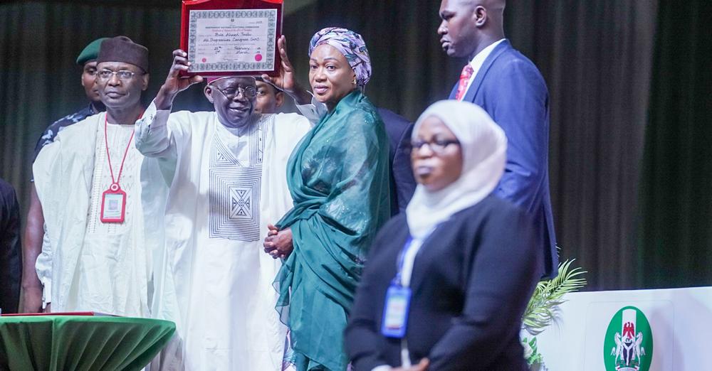 Tinubu shows the certificate of return