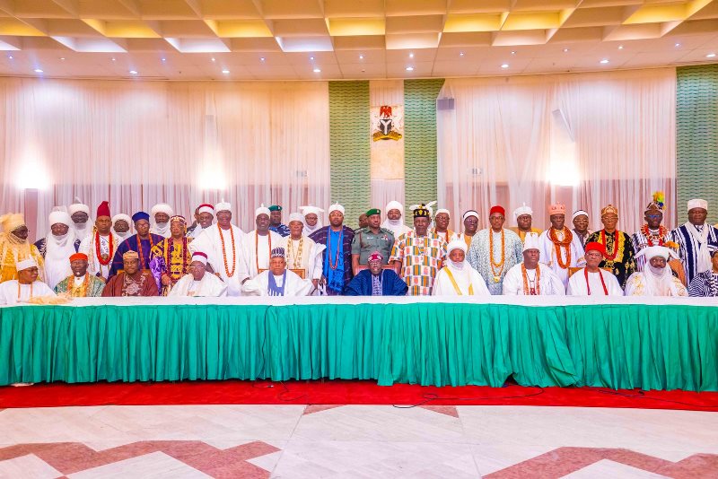 The president with traditional rulers after the meeting in Abuja.