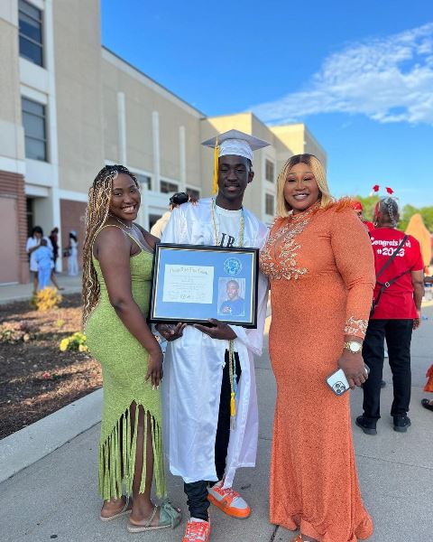 Jibola with his mom and sister during his graduation in US