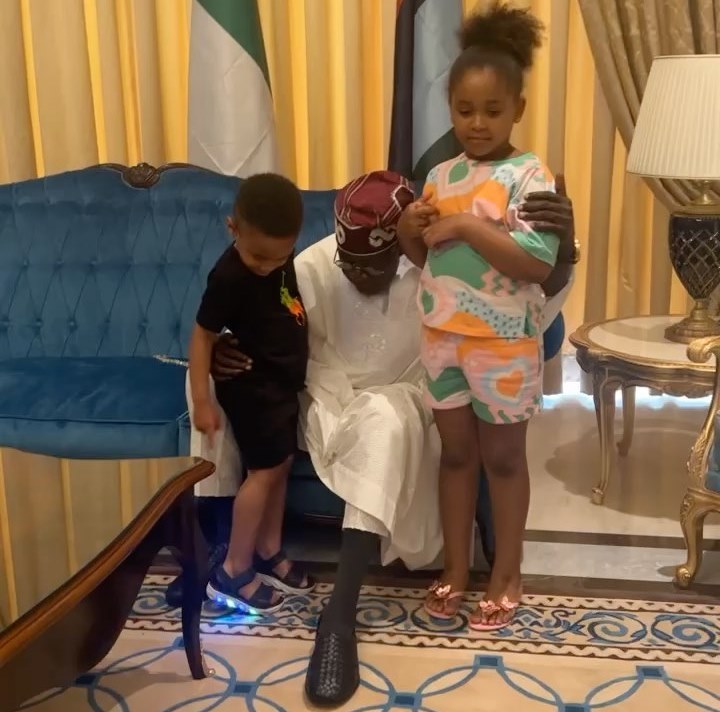 The president playing with his grandchildren