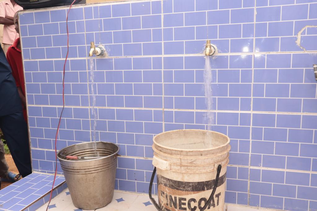 Kogi businessman, Chief Momoh Y. Obaro, unveils water project for the people of Ogaminana community during a 'meet the people forum' 