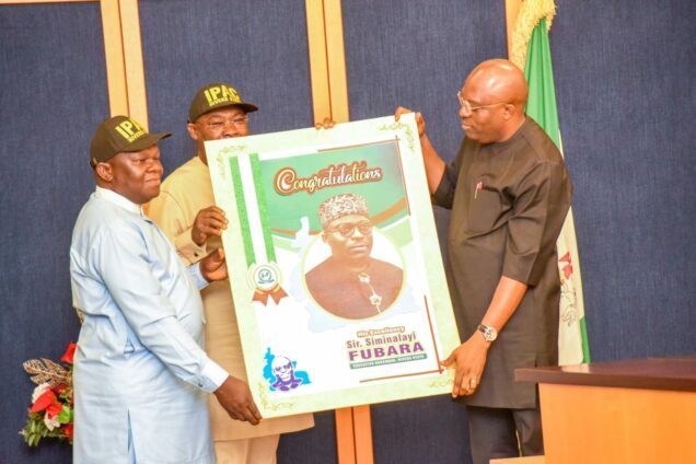 Governor Siminalayi Fubara receiving felicitation card from IPAC Chairman, Amb. Desmond Akawor & Omangima Harry, Secretary during a visit at the Executive Council Chambers, Government House, Port Harcourt on Thursday