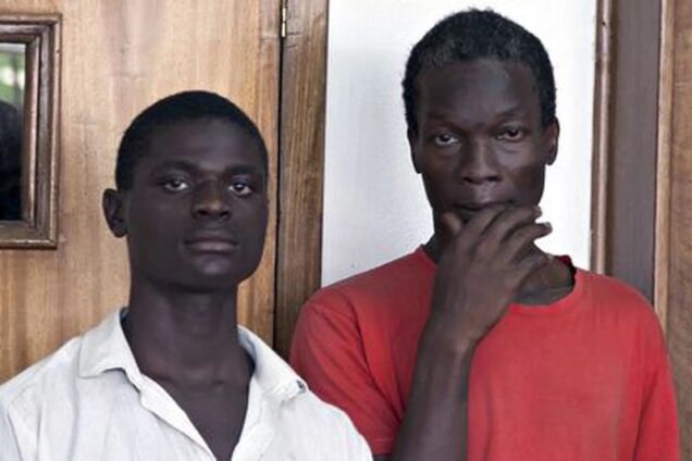 File copy- 2 Ugandans charged with homosexuality in 2014- Jackson Mukasa, left, and Kim Mukasa, right,