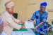 Osun governor Ademola Adeleke presenting certificate to one of the retirees