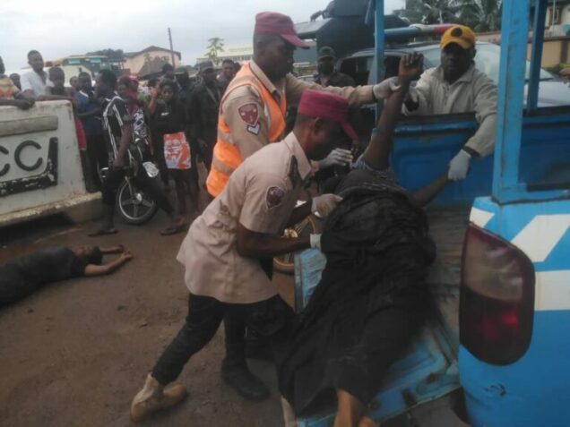 One of the women crushed to death by  a container that fell on a bus they were in at Odumodu Junction on Nteje-Awka, Anambra State being taken away by FRSC operatives