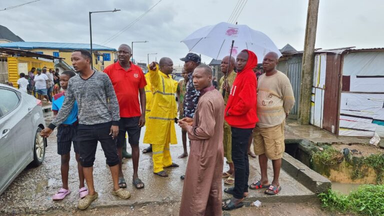 Flood from heavy rain in Lagos sweeps motorcyclist Mr. Abe into a canal at Ile-Epo area of Alimosho LGA of Lagos State on Saturday.