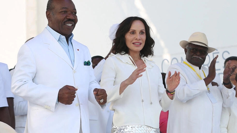 Sylvia Bongo and her deposed husband Ali Bongo, first left